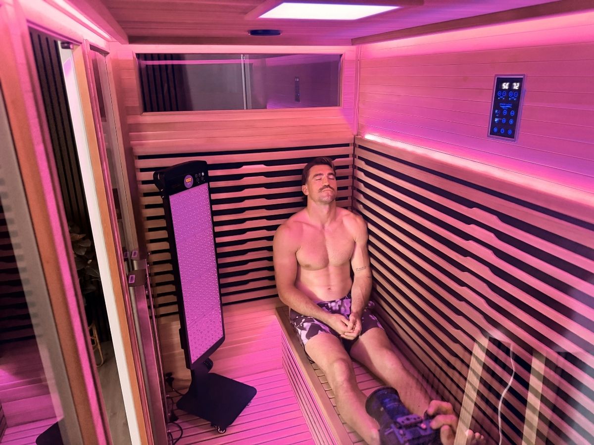 Connor Watson relaxing inside the Bella Five sauna.
